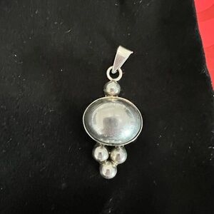 Sterling silver slide. Can be worn on. Eased or plain necklaces.